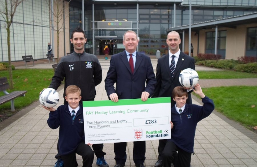 Mark Pritchard presenting a cheque to Hadley Learning Centre.